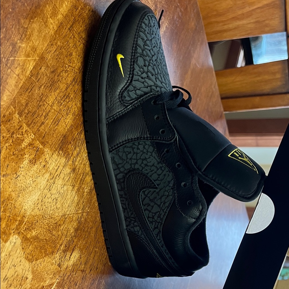 Nike Air Jordan 1 Low SE Black Low-Top Sneakers with Yellow Mini Swoosh
